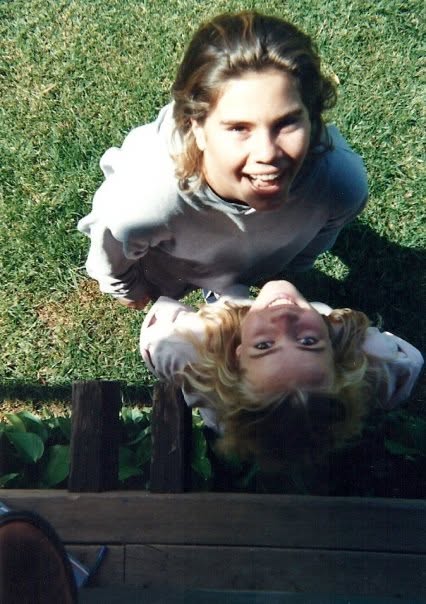 Cindy and Tiffany at thirteen, on the grass